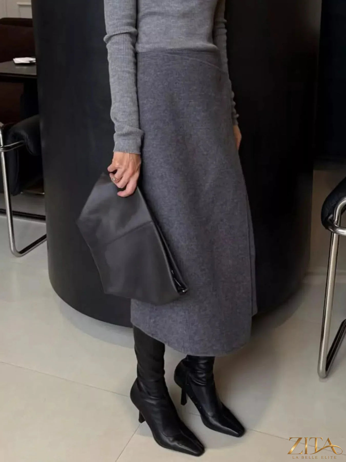 High-waisted wrap midi skirt from Trendsi featuring a flattering fit and stylish design, shown in a neutral fabric.