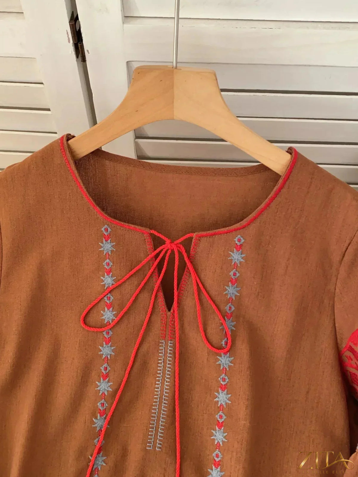 Zita La Belle Elite embroidered tie neck blouse featuring intricate embroidery and a stylish tie detail at the neckline.