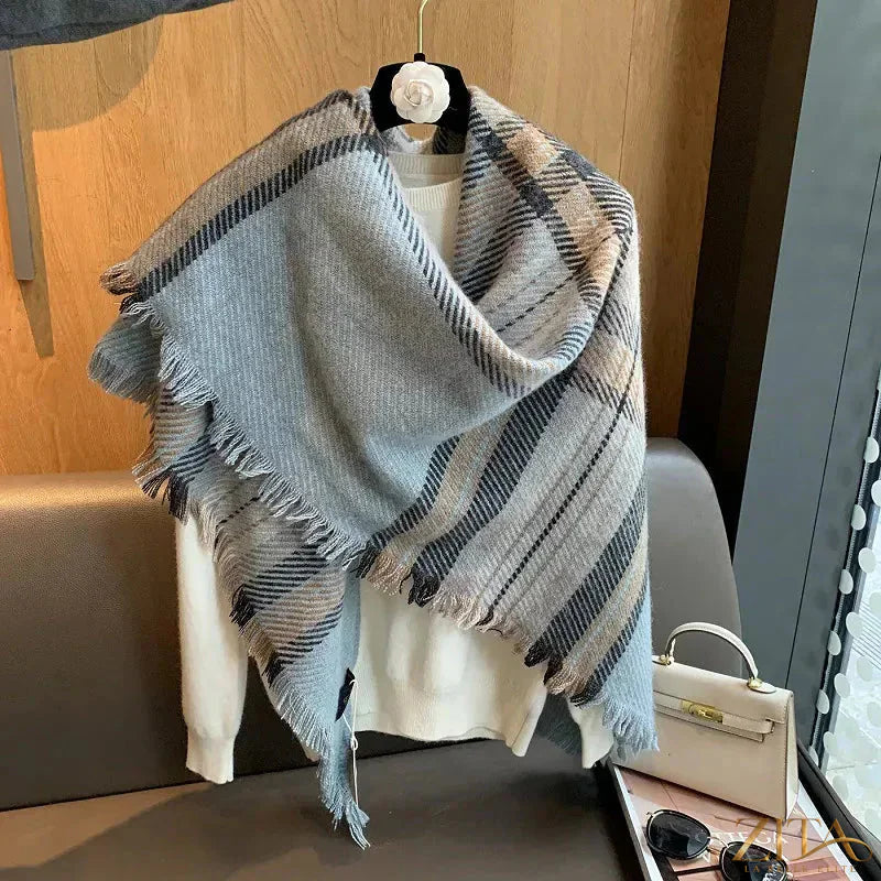 Raw hem plaid scarf from Trendsi featuring soft fabric, classic plaid pattern, and fringed edges for a cozy, stylish look.