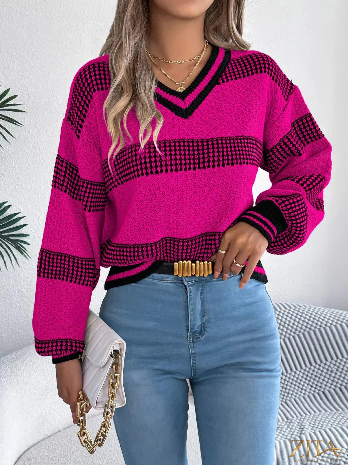 Contrast striped V-neck sweater by Trendsi featuring bold horizontal stripes and a classic V-neck neckline.