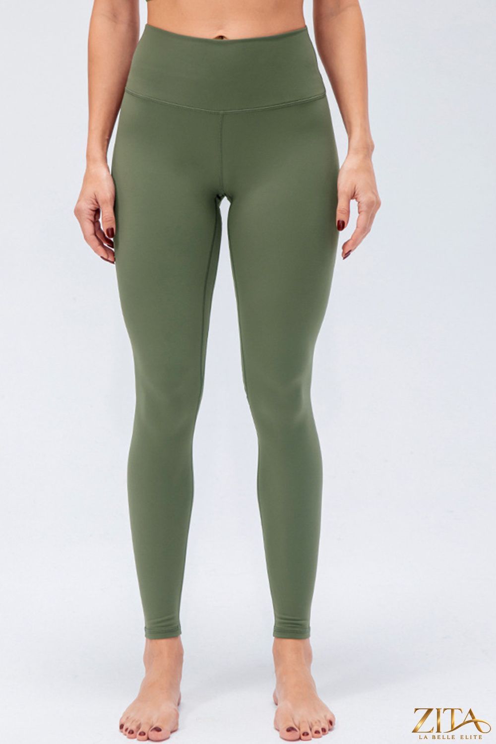 Pair of black slim fit active leggings with wide waistband from Trendsi, designed for comfort and flexibility during workouts.
