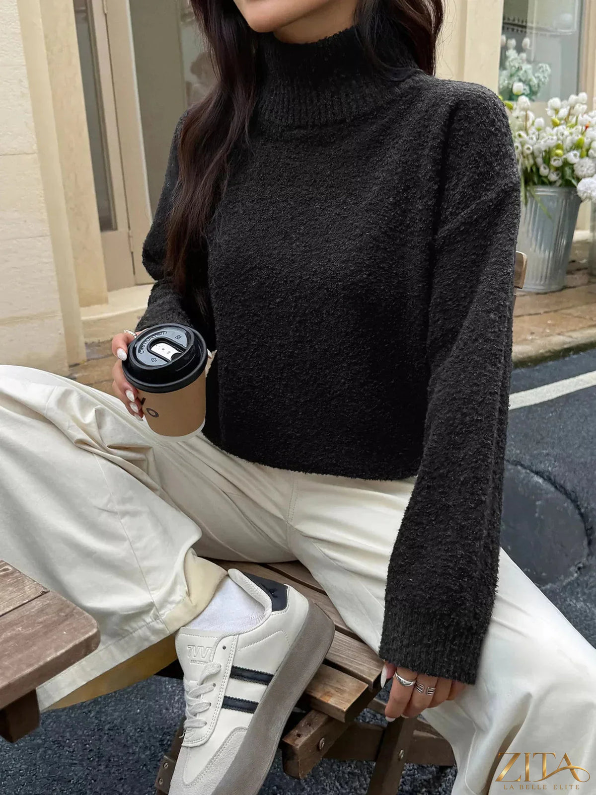 Zita La Belle Elite turtleneck long sleeve sweater in cozy knit, close-up of dark-colored fabric and ribbed collar detail.