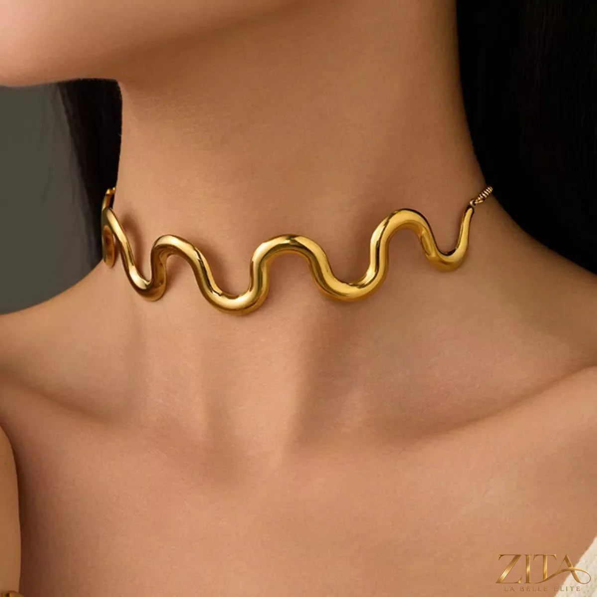 18K gold-plated wave necklace by Zita La Belle Elite featuring a sleek, flowing design on a delicate chain.