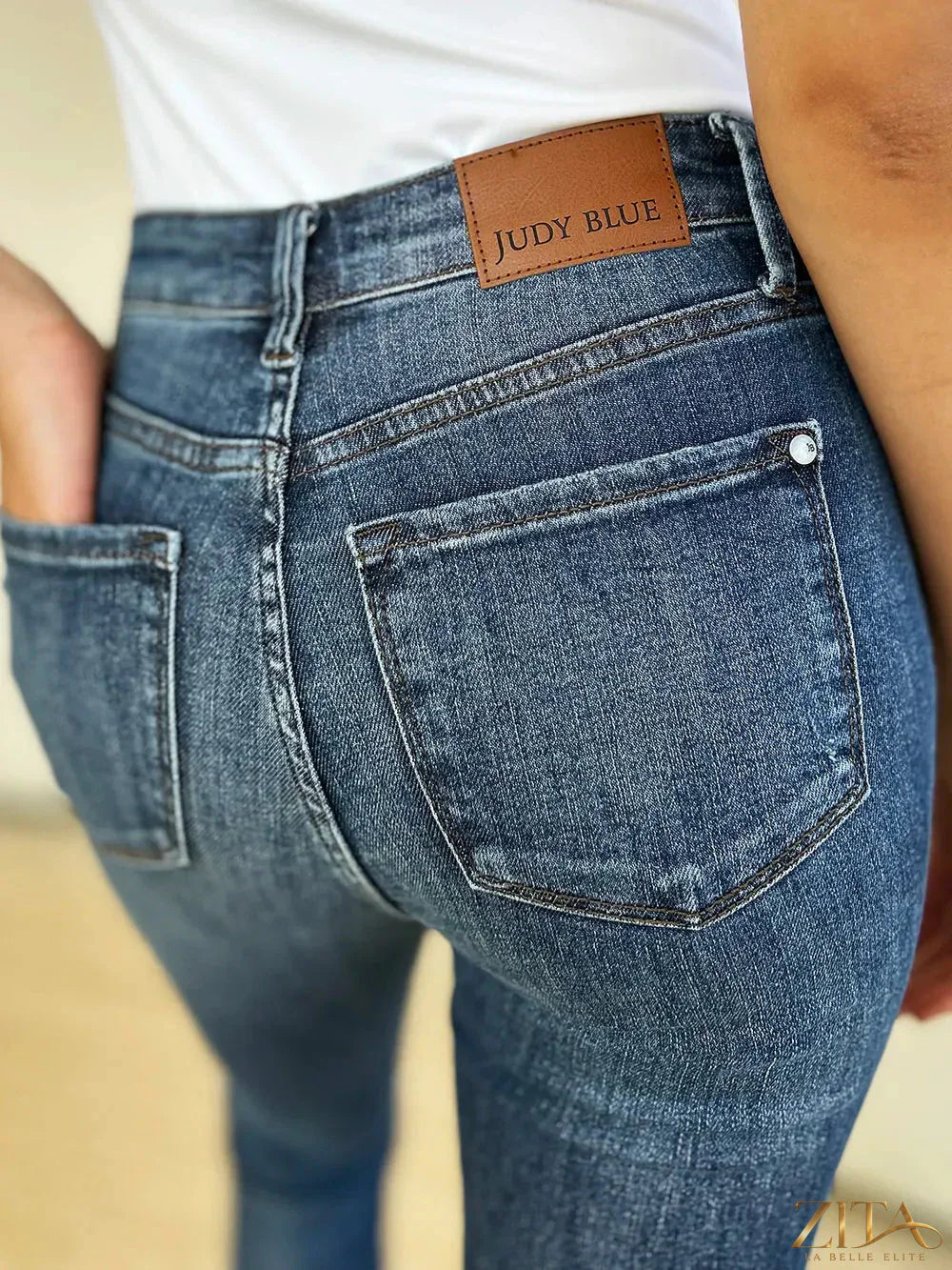 Zita La Belle Elite Judy Blue full-size mid-waist distressed slim jeans displayed on a model.