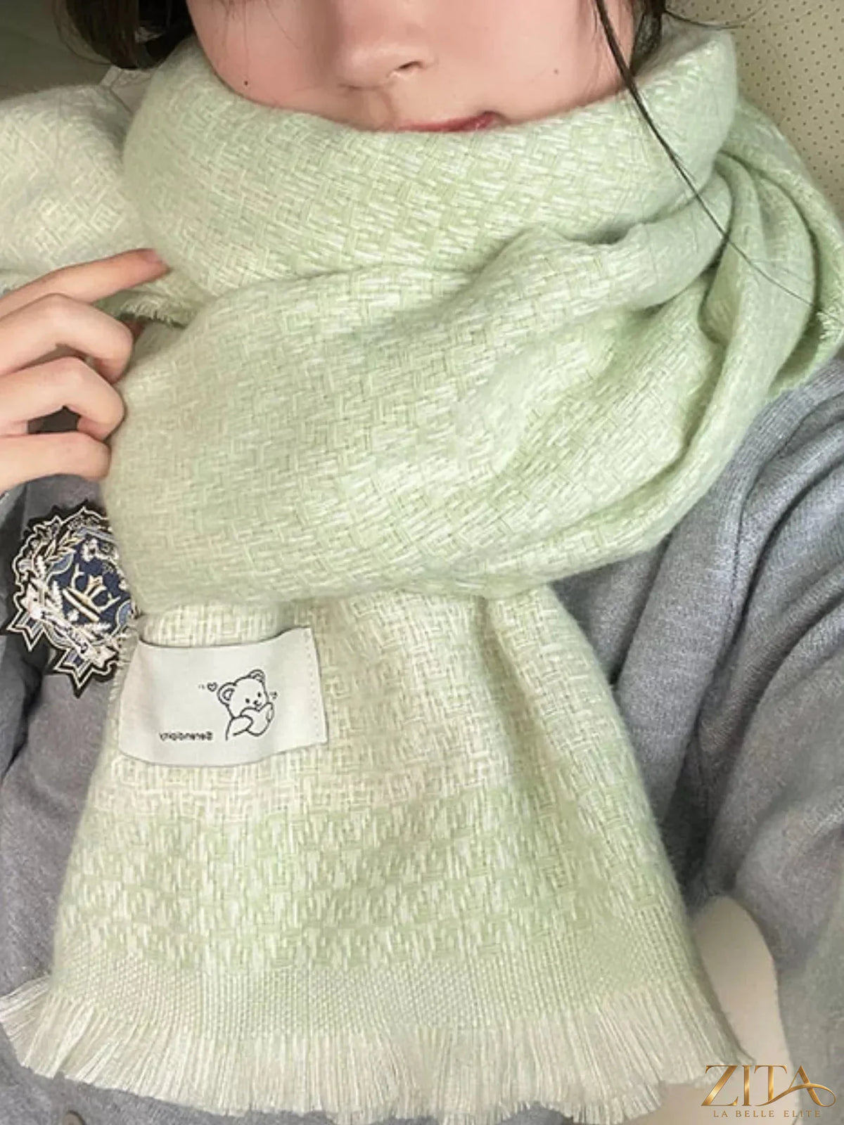 Raw Hem Zita La Belle Elite scarf with fringed edges, soft fabric, and neutral color, styled casually on a model.