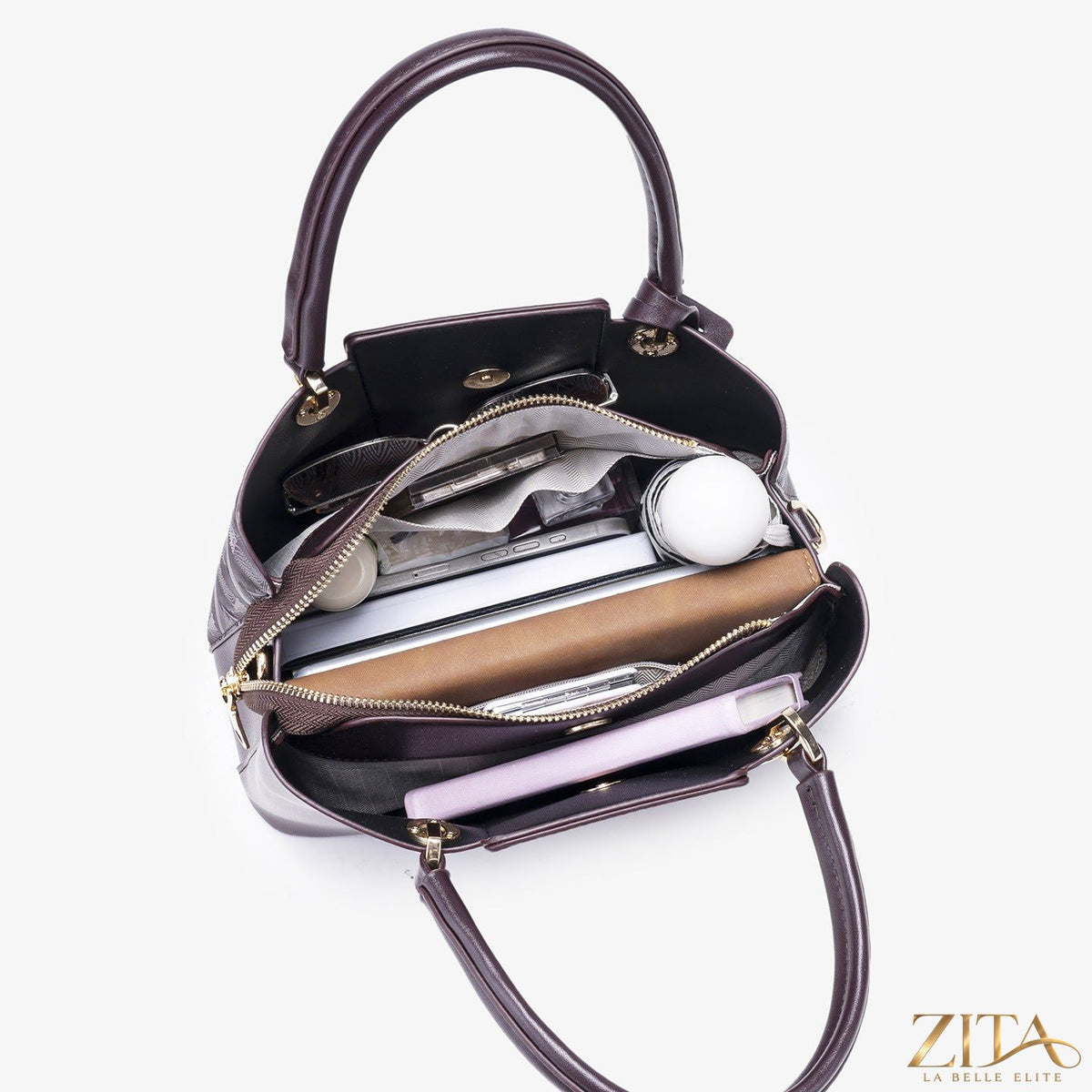 Zita La Belle Elite embossed pattern leather top handle handbag with textured surface and elegant design.
