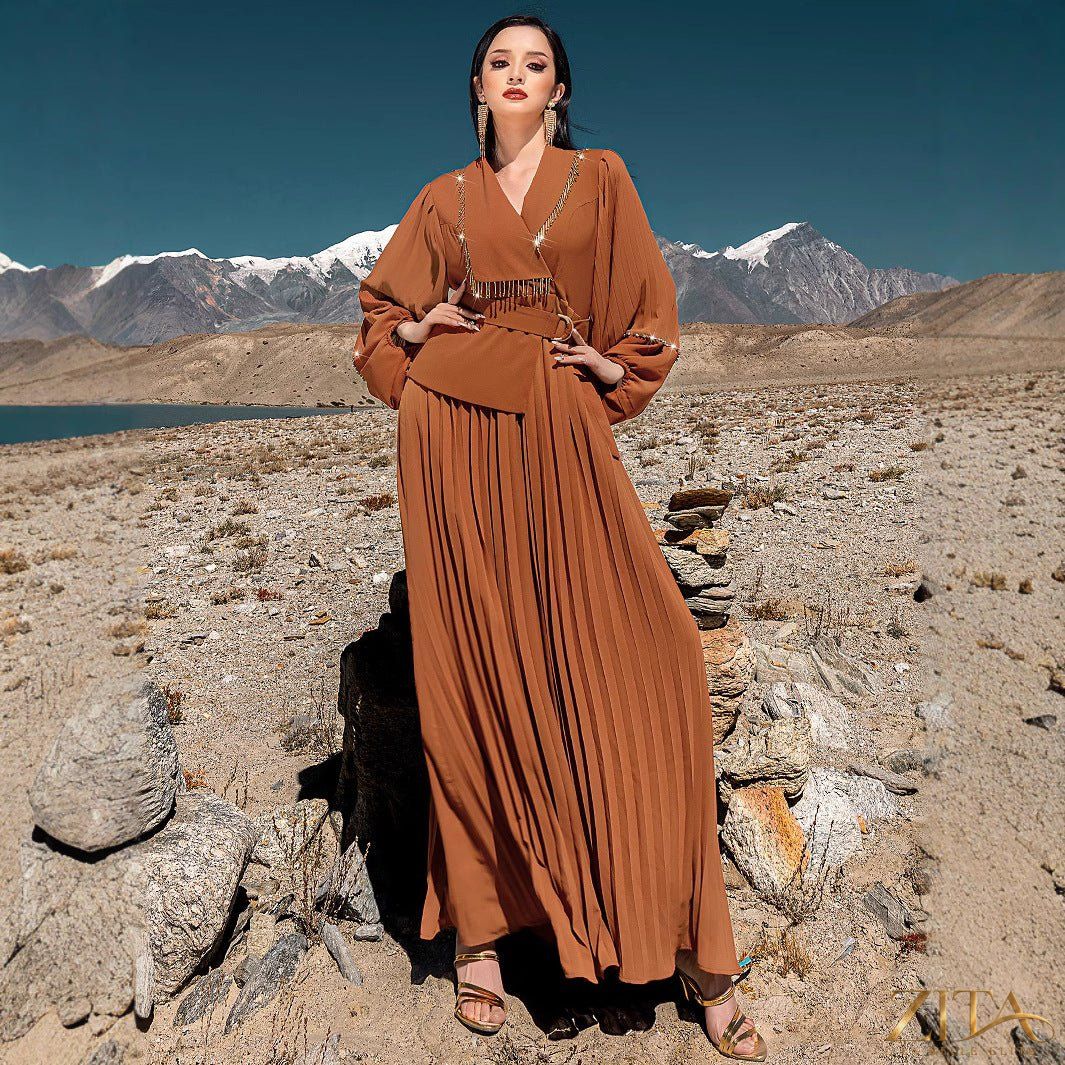 Zita La Belle Elite hand-beaded V-neck pleated maxi gown with bubble sleeves and crystal embellishments.