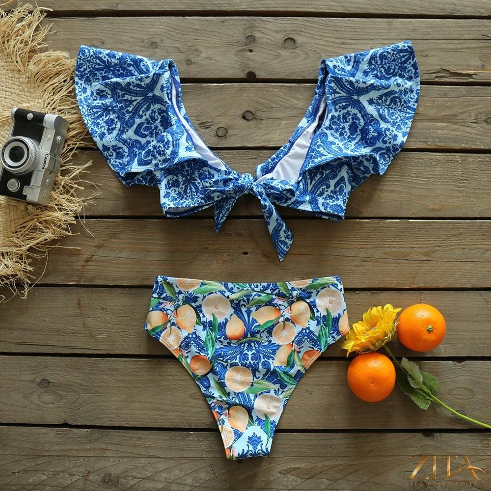 Zita La Belle Elite Ruffle Push-Up Bandage Bikini Set with padded bra, ruffles, and low-rise two-piece swimwear on a beach.